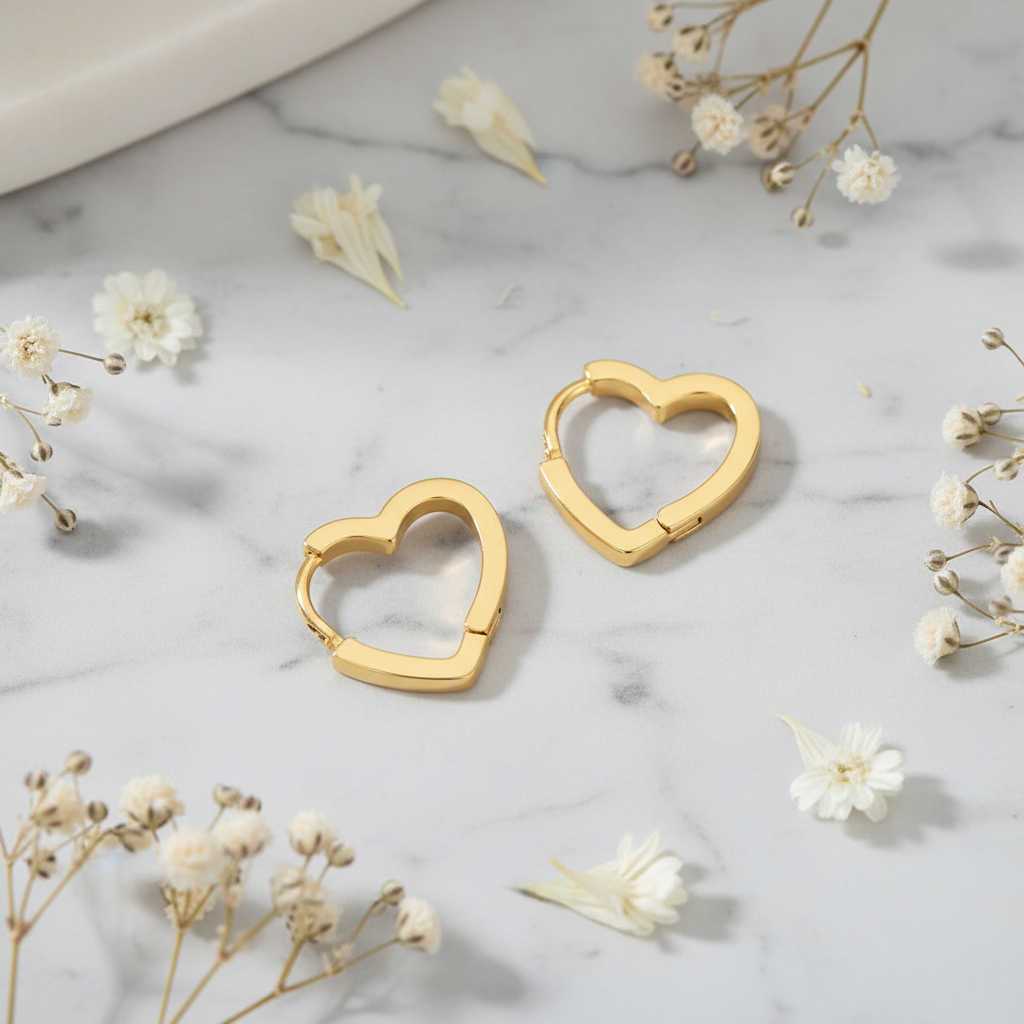 Moonlit Heart Earrings gold on grey marble with dried flowers