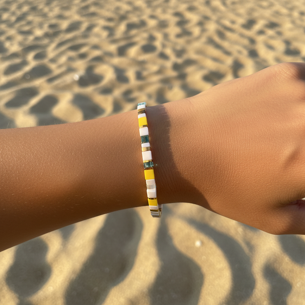 Sunbeam Spell Bracelet worn on wrist at beach