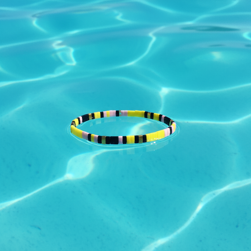 Horizon Charm Bracelet on turquoise water