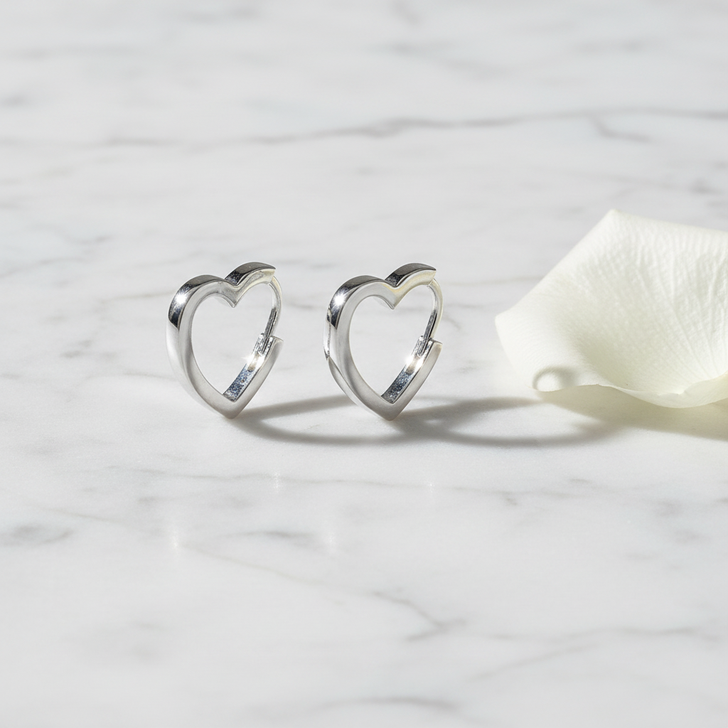 Moonlit Heart Earrings silver flat lay on white marble with rose petal